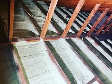 There is a lot of foam on the floor of the attic.