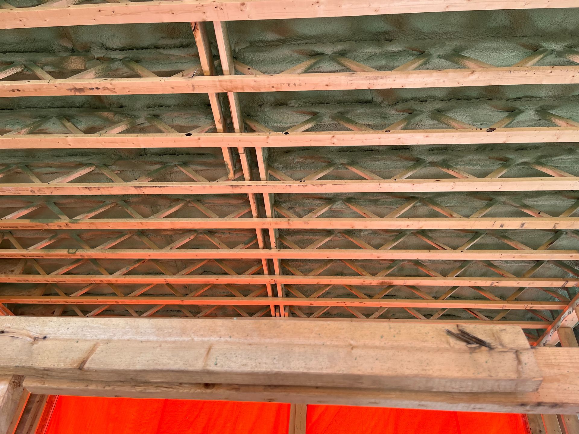A close up of a wooden ceiling in a building under construction.