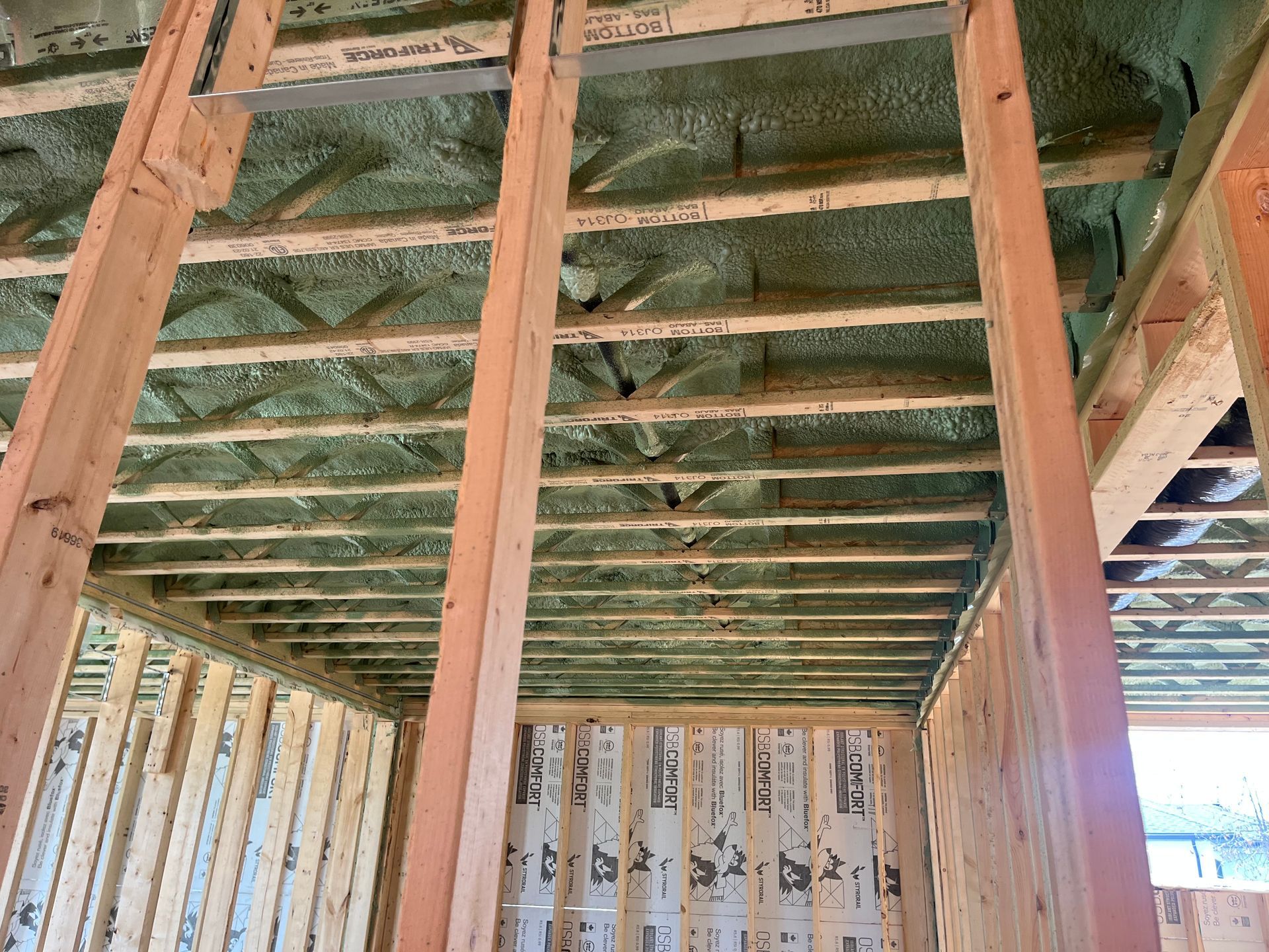 A house is being built and the ceiling is covered in insulation.