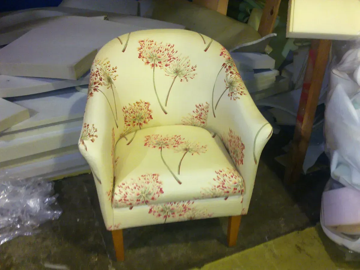 A chair with a dandelion pattern on it