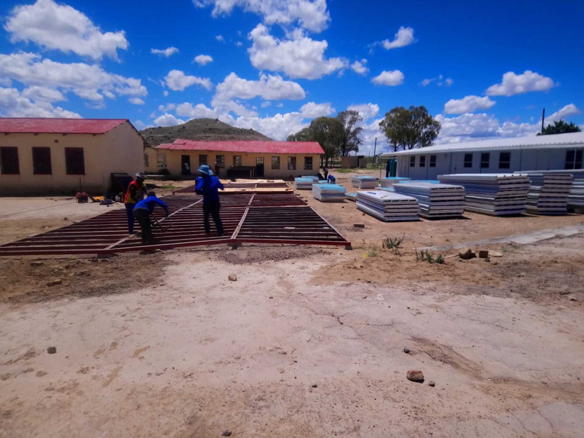 A group of people are working on a construction site.