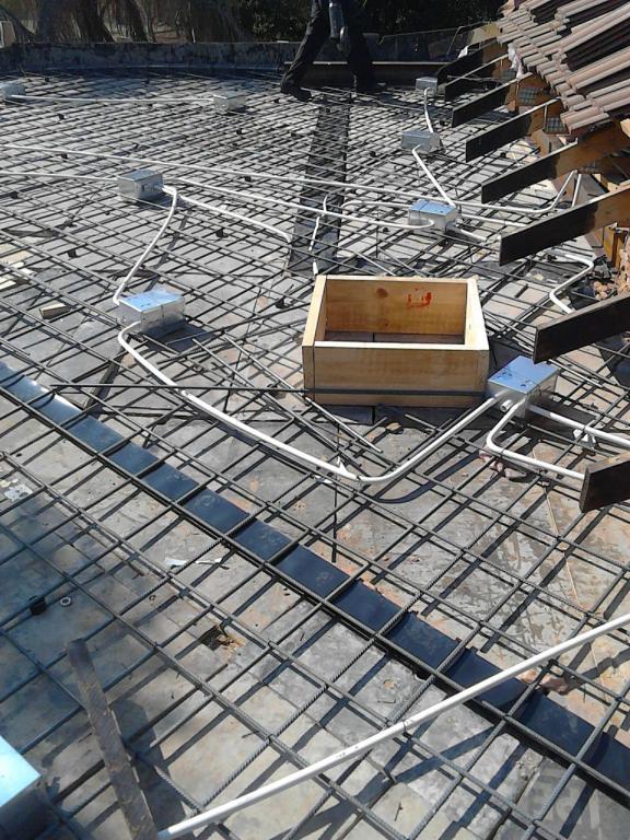 A picture of a concrete floor and a picture of a building under construction