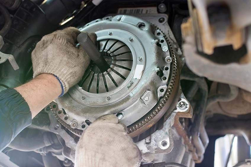 A Person is Working on a Clutch — AEQ - Auto Electrics QLD in Woombye, QLD