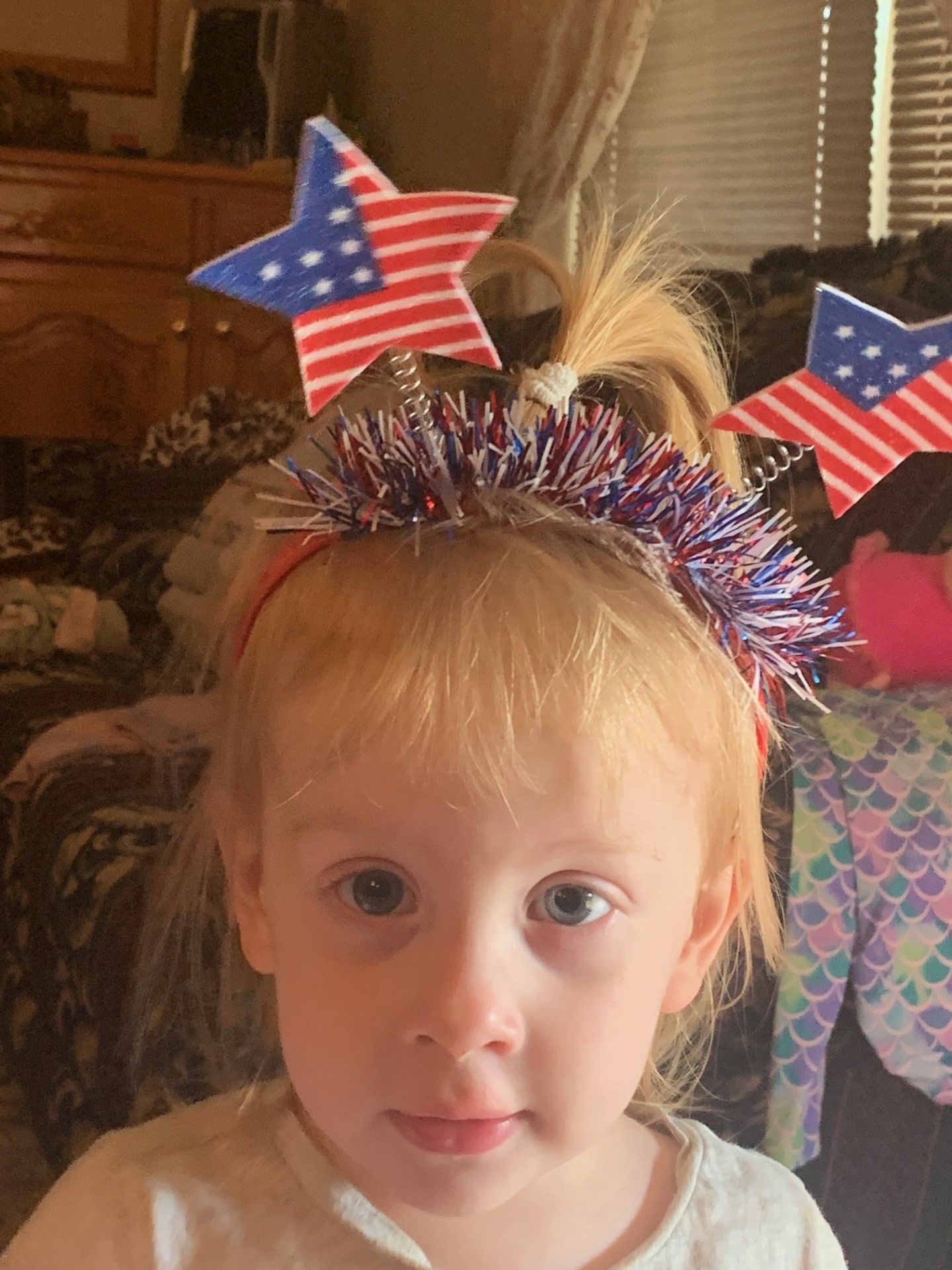 little girl with july 4th headband on