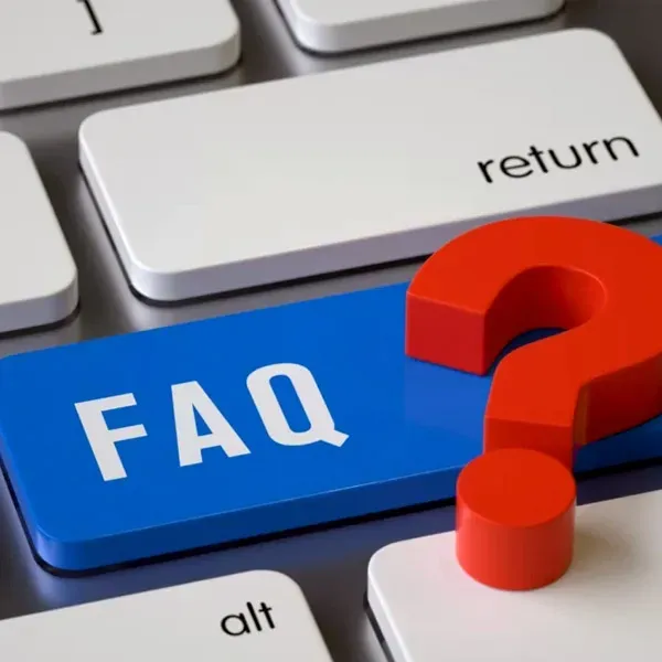 Blue FAQ key with a red question mark on a computer keyboard