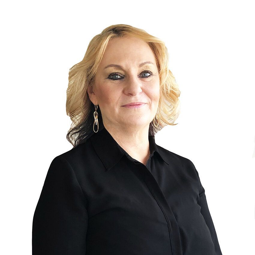Portrait of a woman in a black blouse against a white background