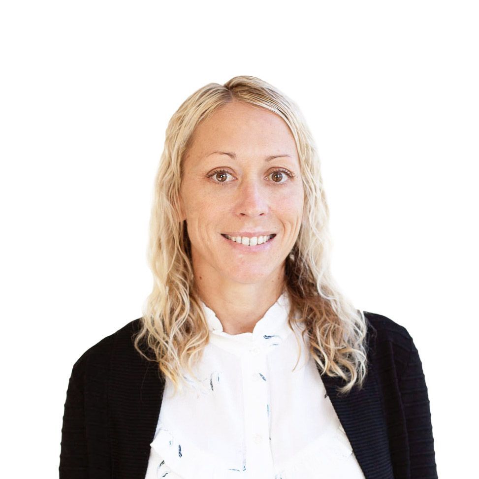 Portrait of a smiling blonde woman in a black cardigan and white blouse on a white background