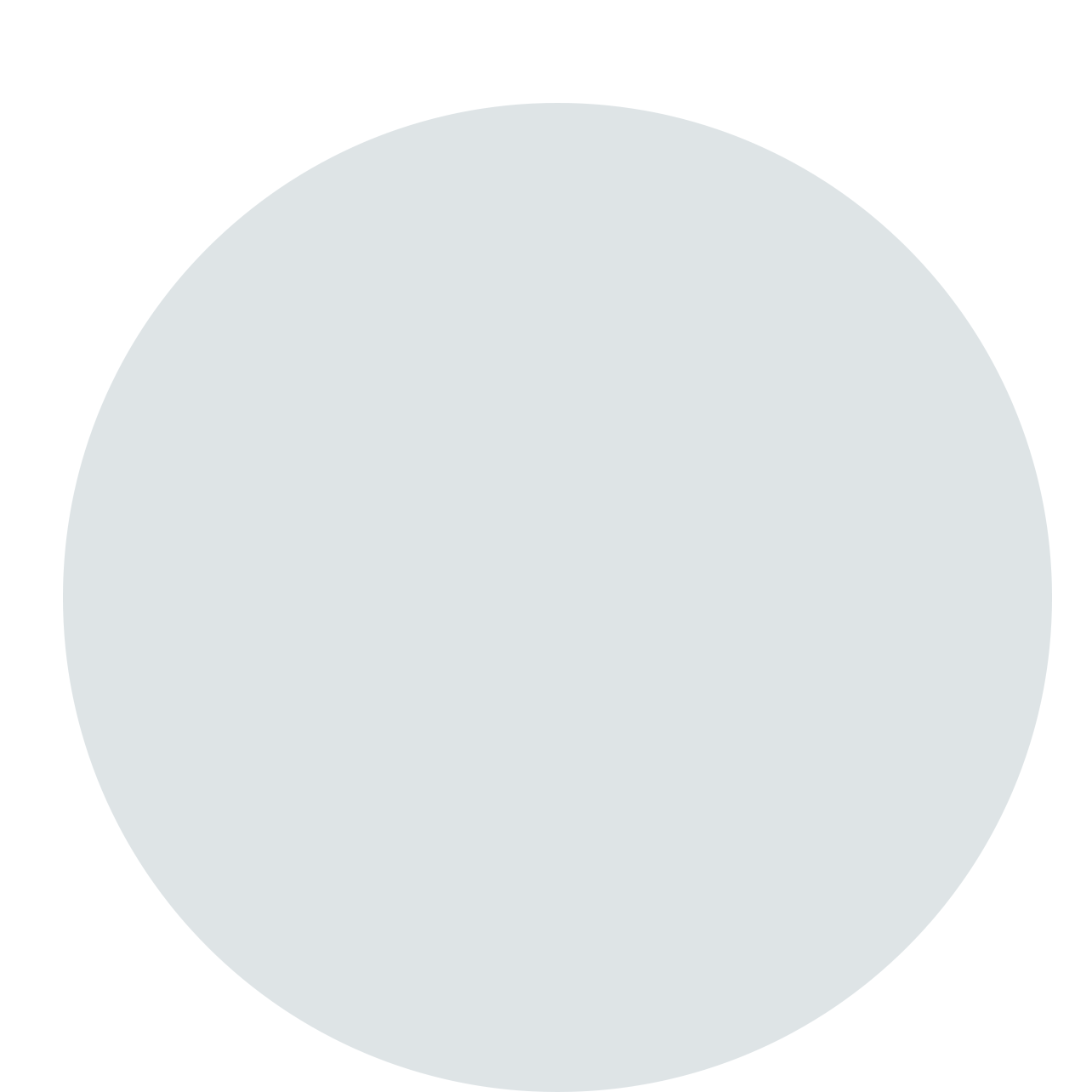 A man in a gray shirt is smiling in a circle.
