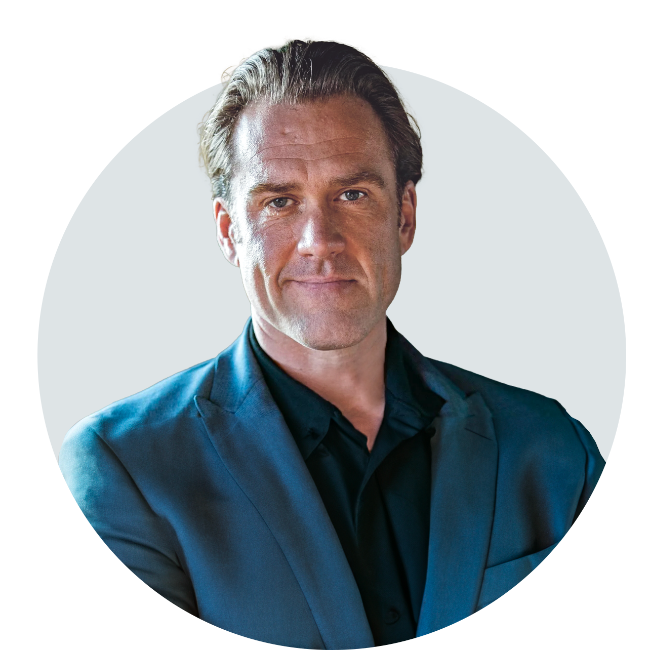 A man in a blue suit and black shirt is in a circle.