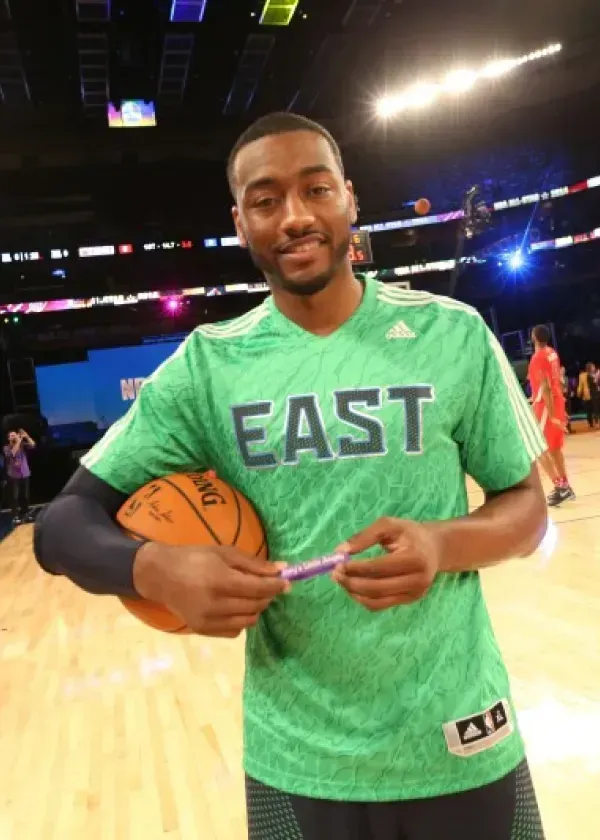 Basketball player John Wall in a green 