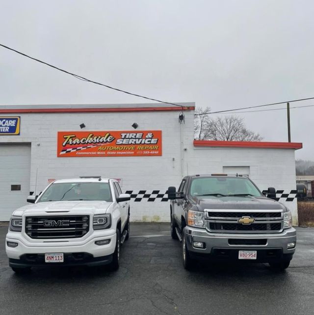 Trackside Truck Auto And Equipment Shop Exterior With Service Trucks | Trackside Truck Auto And Equipment