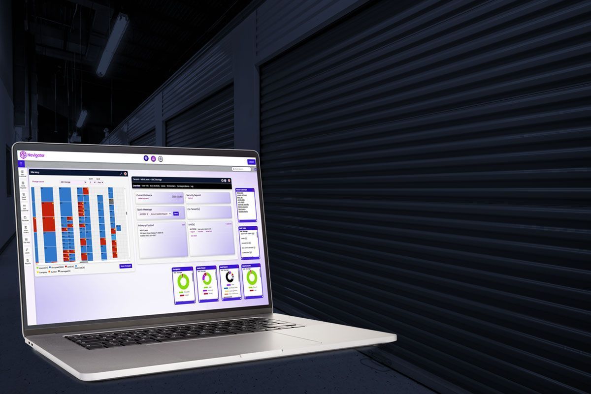 Laptop displaying analytics dashboard in a dark industrial setting