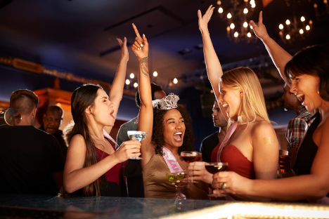 Four women celebrating at a bachelorette party. 
