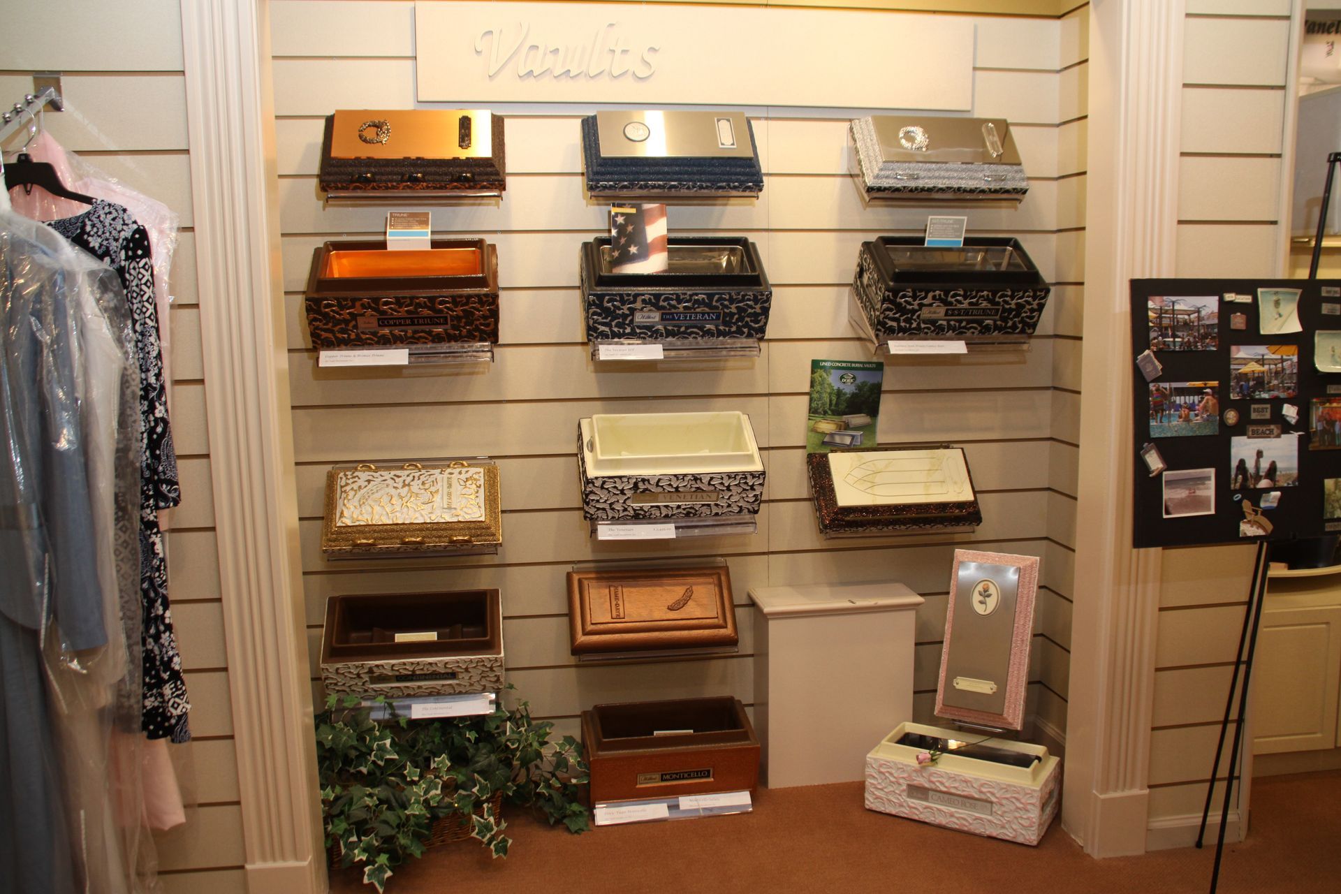Shelving display of assorted wallets and clutches in a store boutique