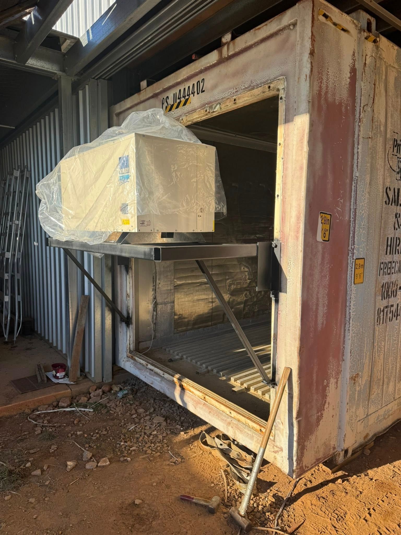 Shipping Container with A Mounted Unit Projecting from The Opening — Canobolas Air in Mudgee, NSW