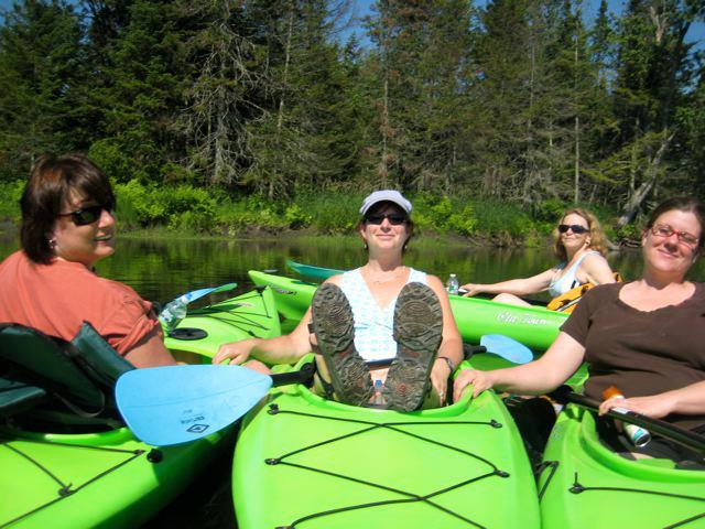 A group of kayakers on a Clyde River Recreation group trip