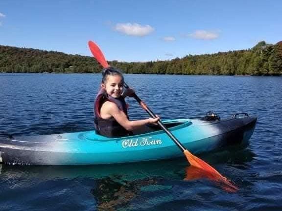 A child in a child size kayak