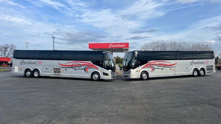 Students riding a school bus on a field trip, showcasing safe bus rental in Delaware, OH by Cardinal