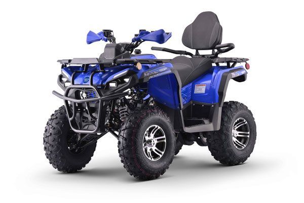 Blue all-terrain quad bike with black trim and large knobby tires, shown on a white background