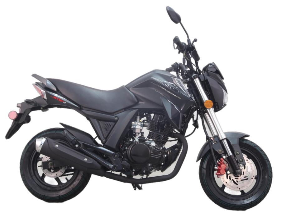 A black motorcycle is sitting on a white background.