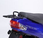 A blue scooter with a black seat and a rear rack.