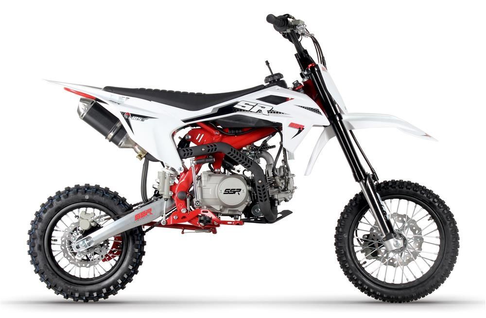 Red and white dirt bike in side view on a white background