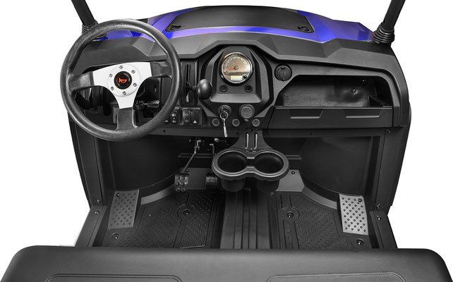 Interior of a black-and-blue off-road utility vehicle with steering wheel, dashboard, and bench seats