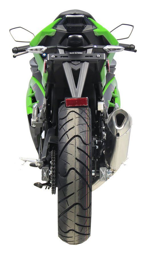 Rear view of a green and black sport motorcycle on a white background