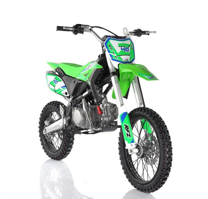 Green and white dirt bike on a white background