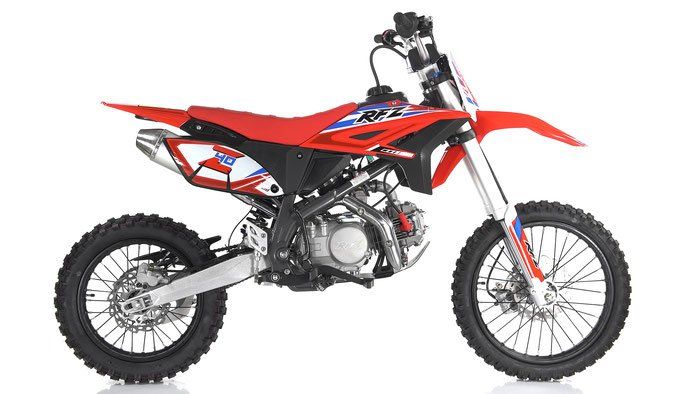 Red and black dirt bike with knobby tires on a white background