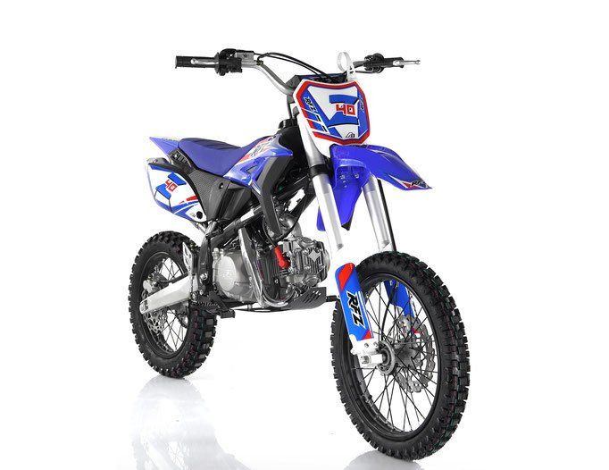 Blue and black dirt bike on a white background, angled three-quarters front view