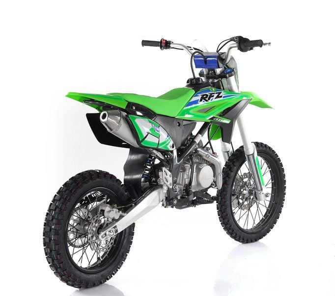 Green and white off-road dirt bike on a white background