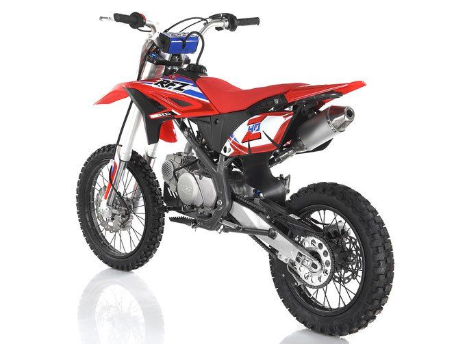 Red and black dirt bike on a white background, angled rear view