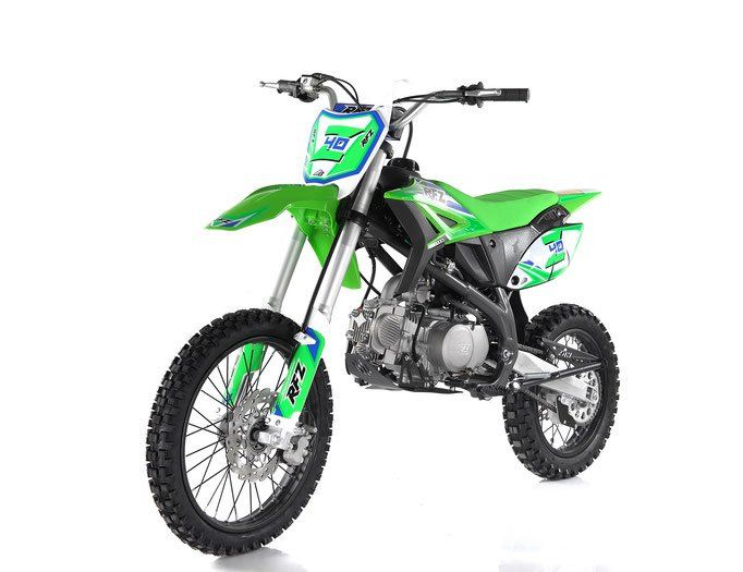 Green dirt bike with black and silver details on a white background