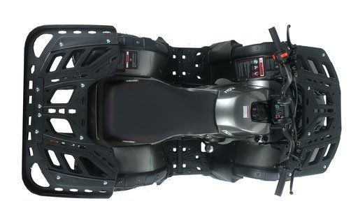Black remote control car with oversized off-road tires, viewed from above