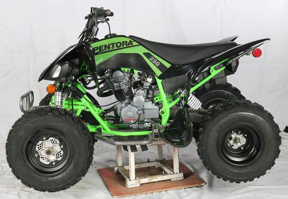 A green and black atv that says pentora on the side
