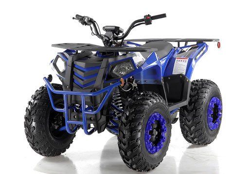 Blue and black all-terrain ATV with rugged tires on a white background