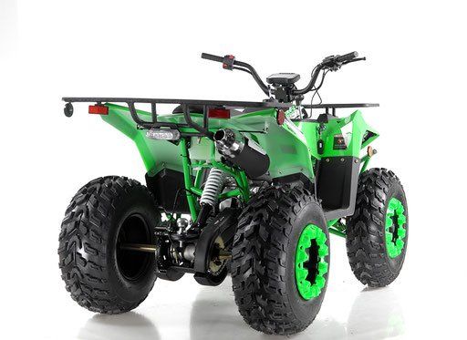 Green four-wheeled ATV with large knobby tires on a white background