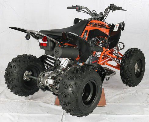 Orange and black all-terrain quad bike with four knobby tires, shown on a white backdrop.