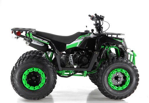Black and green off-road ATV with oversized tires on a white background