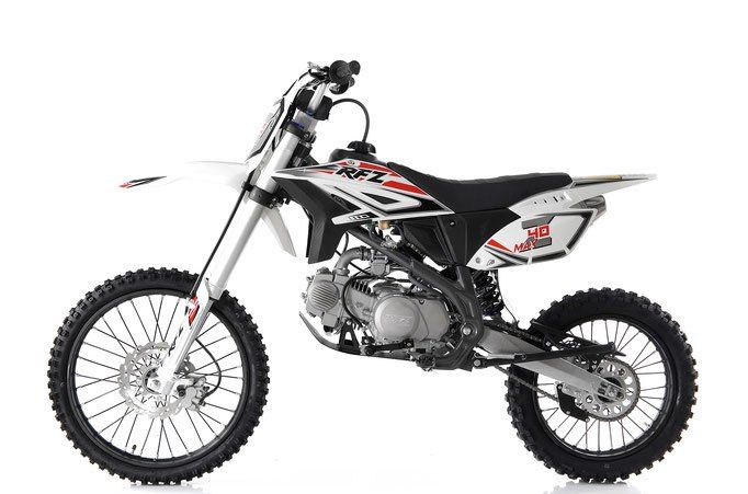 Black and silver off-road dirt bike with knobby tires on a white background