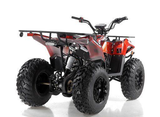 Red and black all-terrain quad bike with large off-road tires on a white background