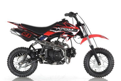 Red and black dirt bike on a white background, side view.