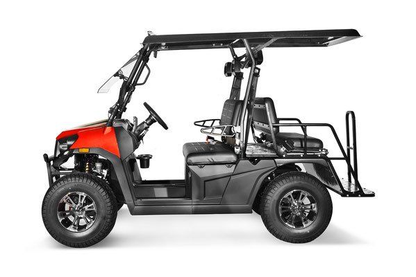 Black and red off-road utility cart with roof and rear cargo bed, side view