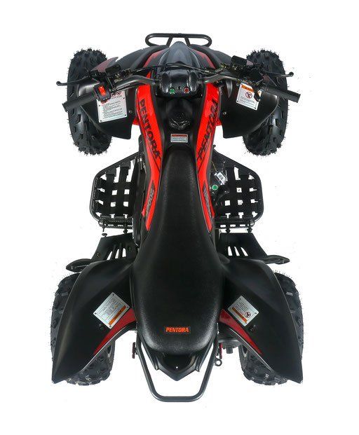 A red and black atv is sitting on a white surface.