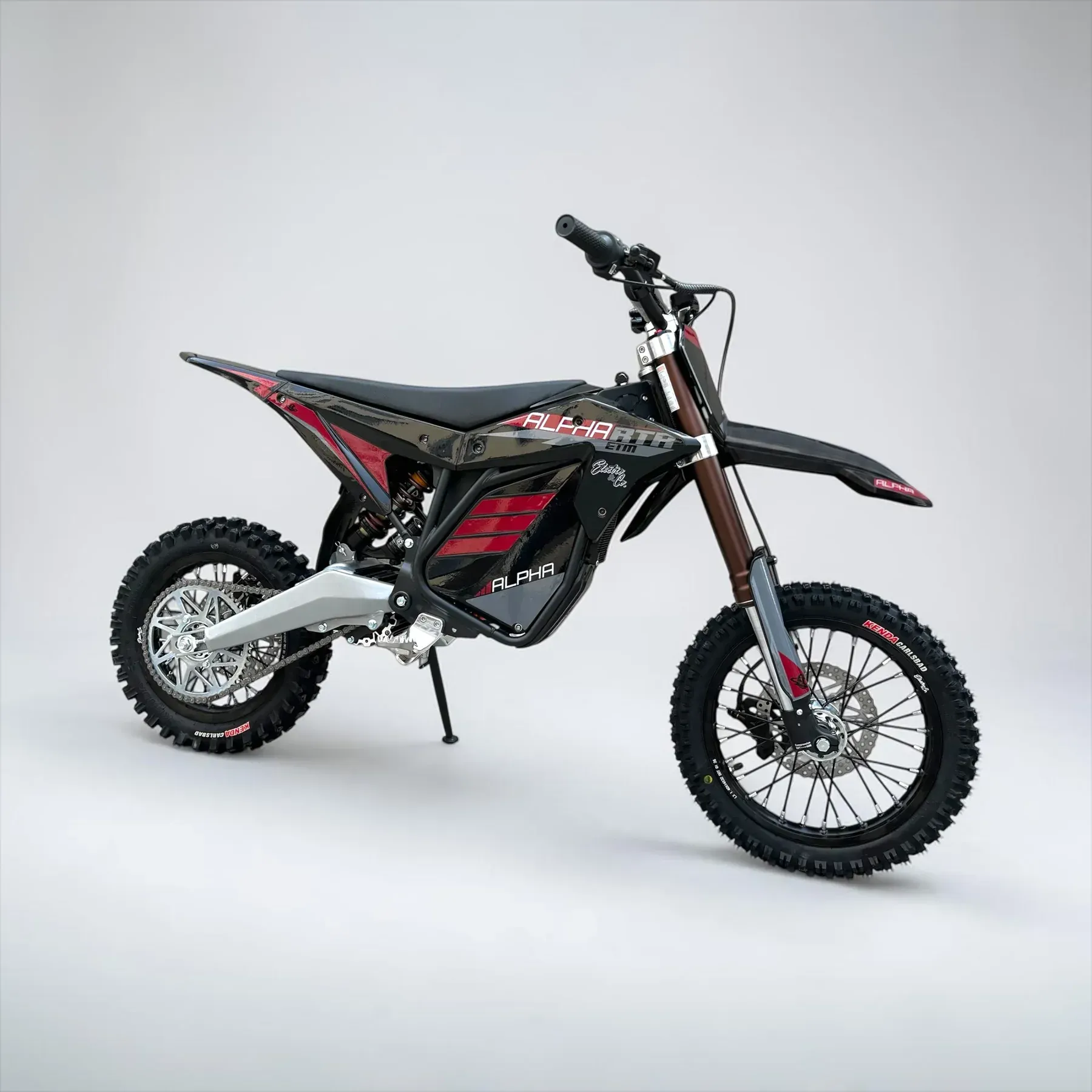 White and black off-road dirt bike in side view on a white background