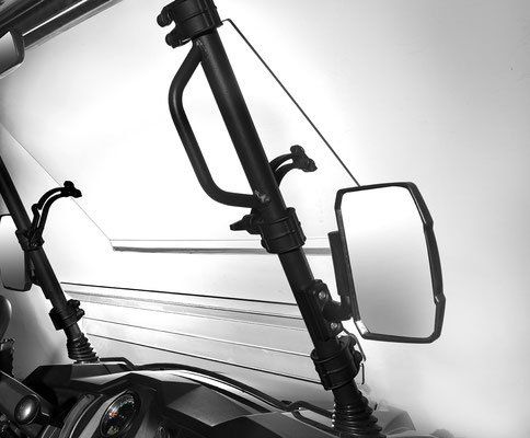Two black side mirrors and windshield supports on a vehicle against a light gray background