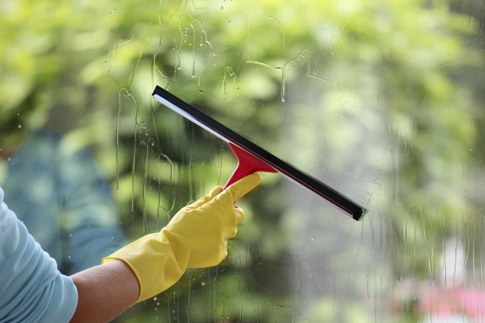 Applying Soap to a Window Surface for Cleaning with Wiper— IPCO Cleaners