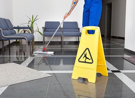 Skilled Cleaner Mopping Hospital Floor — IPCO Cleaners