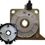 A close up of a gear and a motor on a white background.